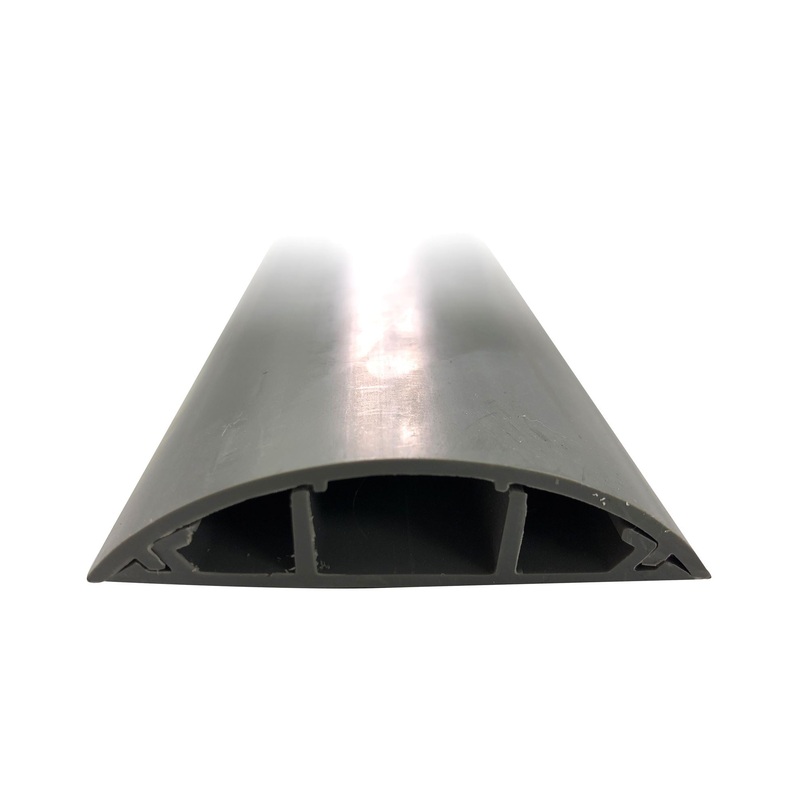 DYNAMIX 1m Floor Mount Round Wiring Duct. Dims –  70mm x 16.5mm (WxH) Includes 2x Strips of Double Sided Tape to Help Secure in Place. Grey Colour.